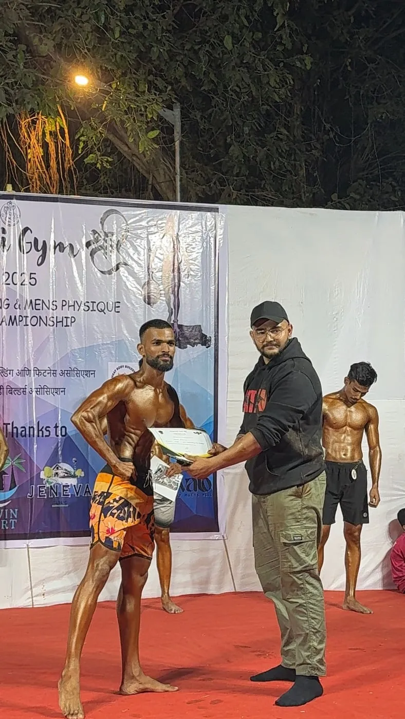 A Bawa Fitness athlete receiving his certificate on stage at Manori Gym Shree 2025